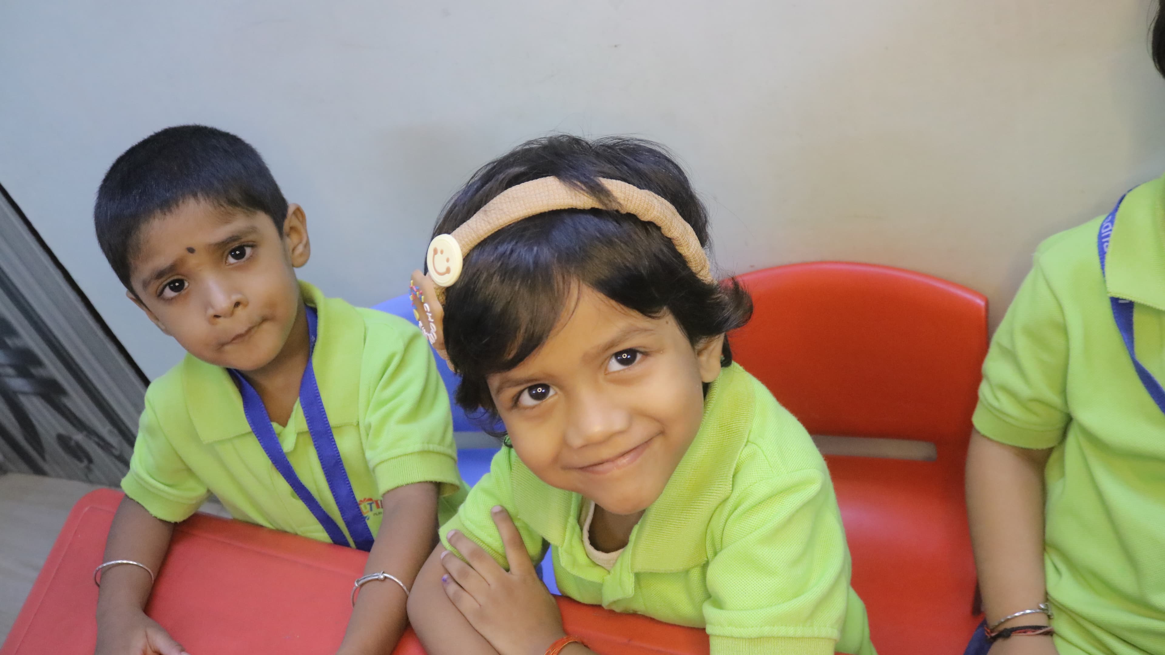 Little Buds students smiling together in class