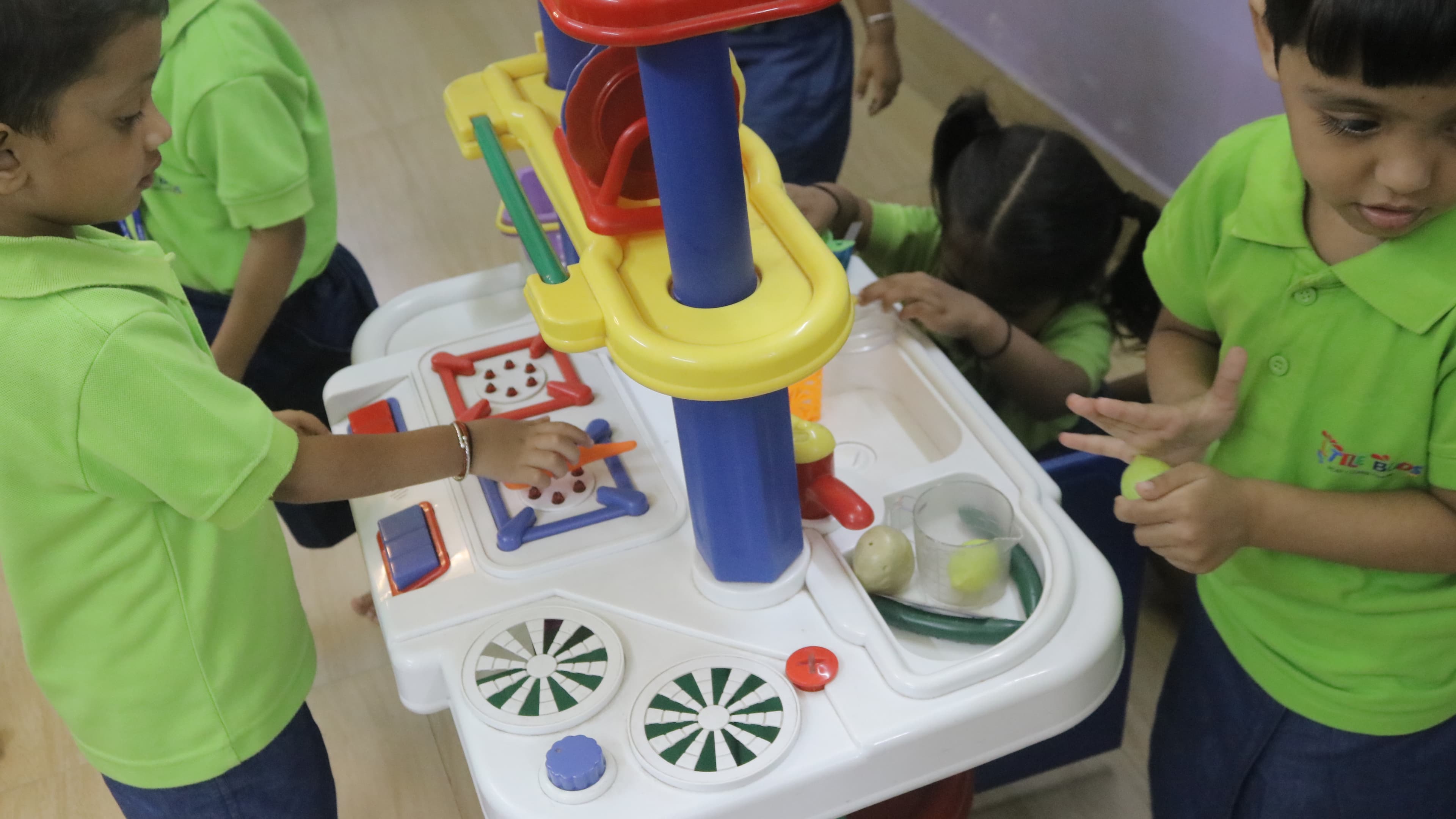 Children playing together at the Little Buds activity kitchen