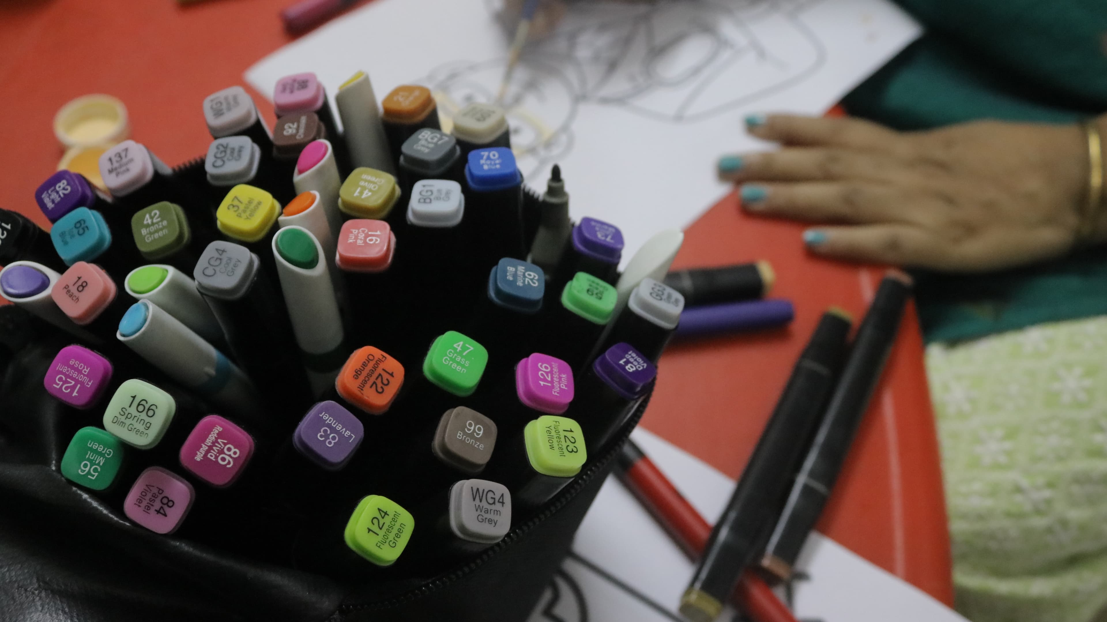 Colourful pens and Little Buds notebooks